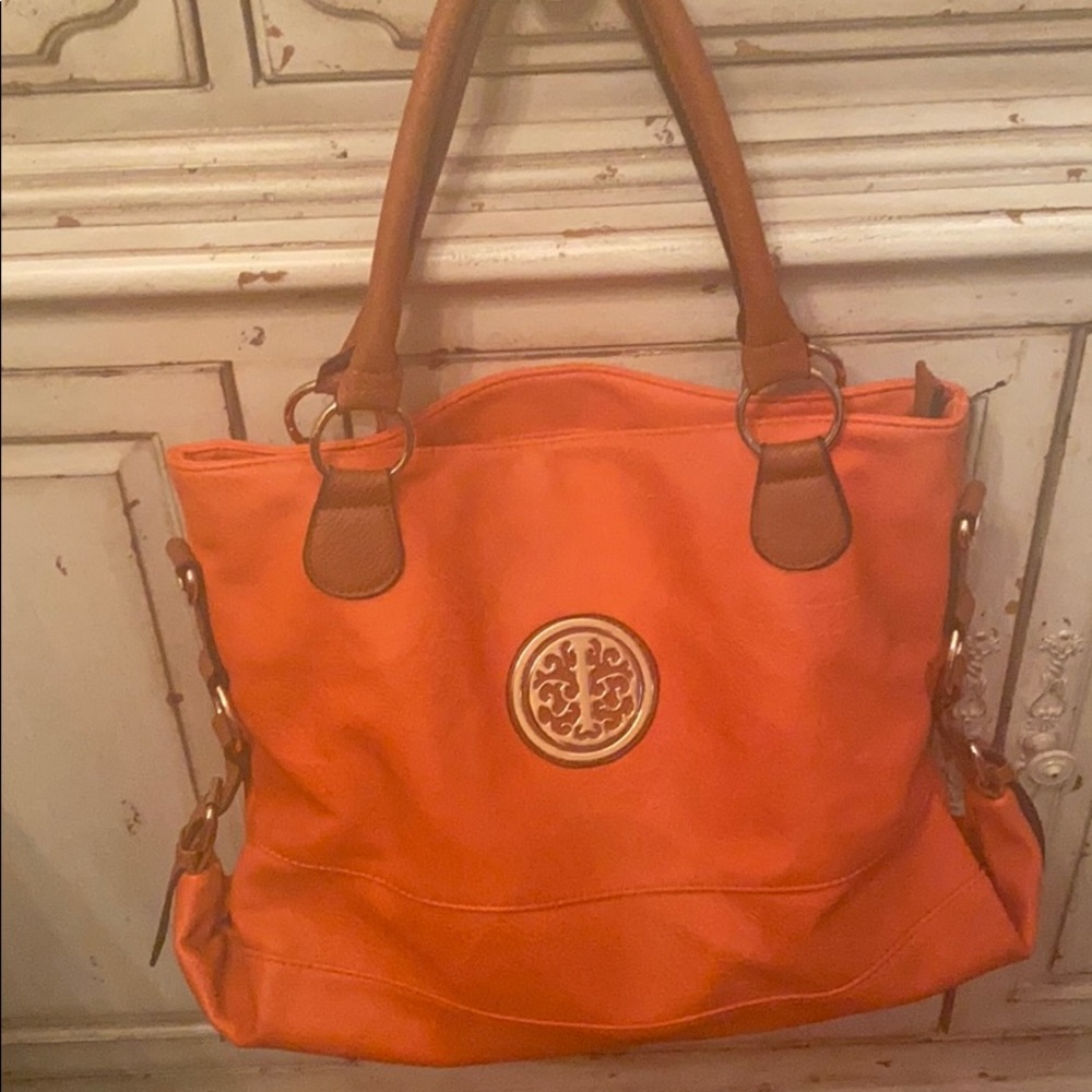 Orange Purse with brown handles and gold hardware